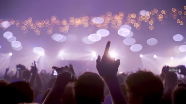 Concert Music festival and Celebrate. Party People Rock Concert. Crowd Happy and Joyful and Applauding or Clapping. Celebration party festival happiness. Blurry night club. Concert Show with DJ Music festival EDM on Stage