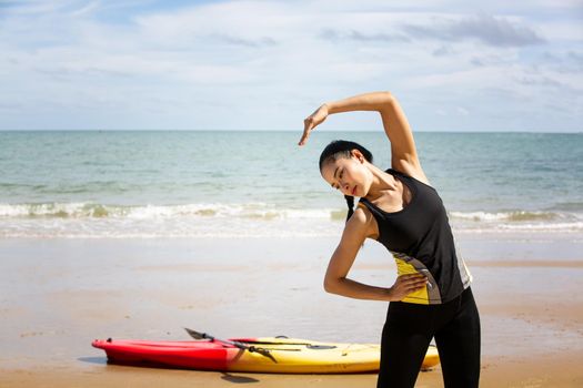 Woman on stand up paddle board. Having fun during warm summer beach vacation holiday, active woman