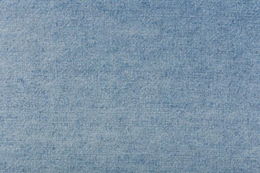 Blue frazzle jeans fabric. Concept of textured background