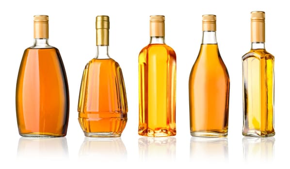 Set of whiskey bottles isolated on white background