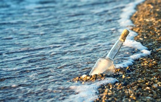 Message in a bottle on an isolated beach