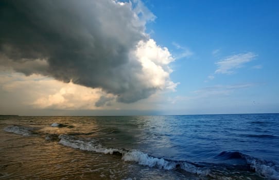 Storm clouds approaching from the roller tropical beach