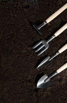 gardening tools and peat on  background