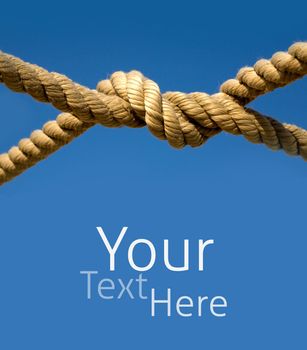 Old fishing boat rope against blue sky