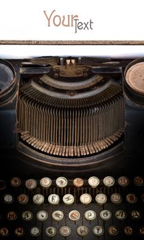 Old type writer with a blank sheet of paper