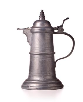 Antique pewter beer jug with lid on white background