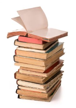 a stack of old books on white background