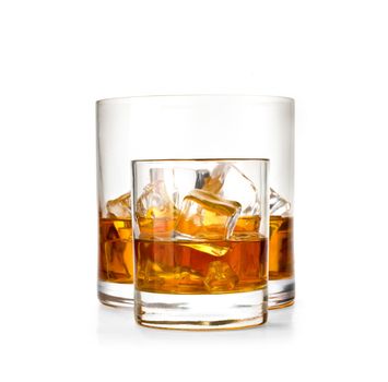 Two whiskey glasses.Isolated on white with reflection