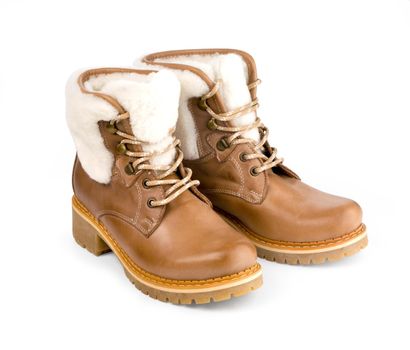 Winter female boots with fur over white . With clipping path