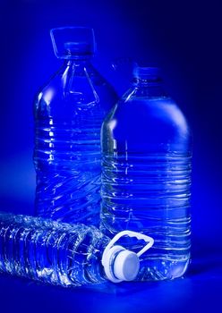 transpatent bottles on the blue background