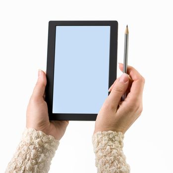 Woman hands holding electronic digital frame with blank screen.