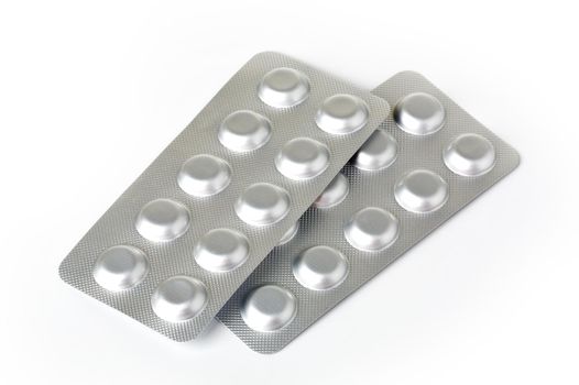 Plate with pills on a white background