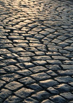 Close-up of the old pavement stones in dark colors