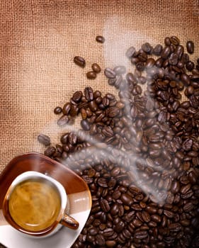 a cup of hot coffee sacking with coffee beans