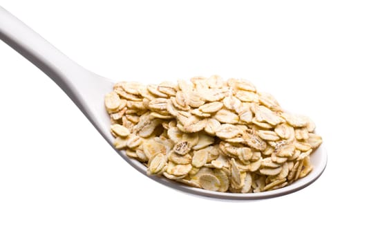 Fresh Whole Grain Oats in a White Spoon Isolated on White with a Clipping Path.