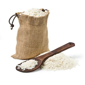 bag of rice and a wooden spoon on a white background. keeping paths