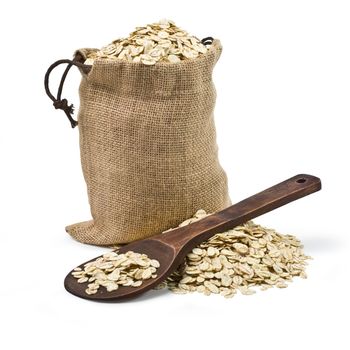 bag of oats and a wooden spoon on a white background. keeping paths