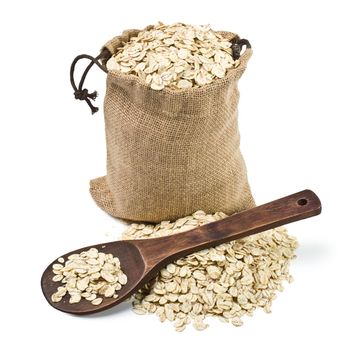 bag of oats and a wooden spoon on a white background. keeping paths