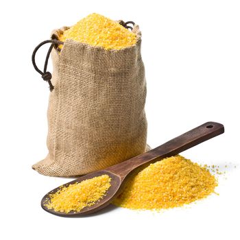 bag of ground corn and a wooden spoon on a white background. keeping paths