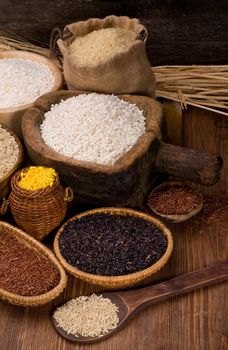 Assortment  of rice in a dark wood