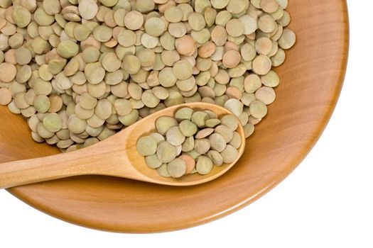 wooden plate with grains of lentils on a white background with clipping paths