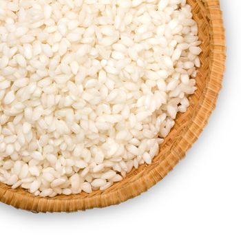 straw plate of risotto rice on a white background