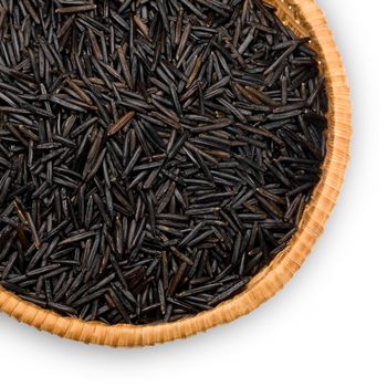 straw plate with wild black rice on a white background