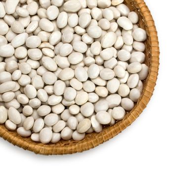 Wicker plate with grains beans close-up on white background