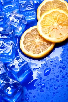 orange and ice on blue background