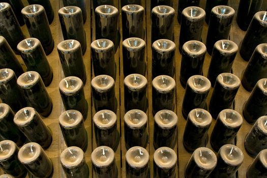 aging champagne bottles in the cellars of the winery