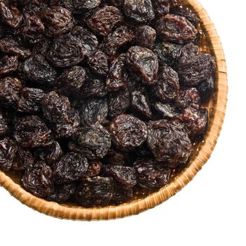 straw dish with raisins on a white background keeping paths