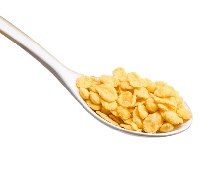 white spoon with corn flakes close up