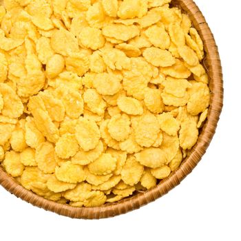 straw plate with corn flakes on a white background, izolated