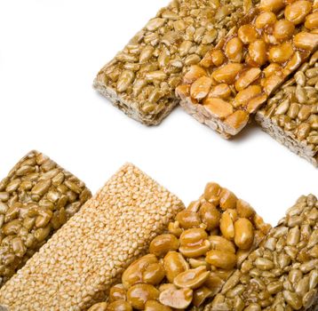 sunflower seeds, sesame ,peanuts in sugar syrup isolated on a white background