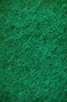 Green abrasive sponge texture background like grass