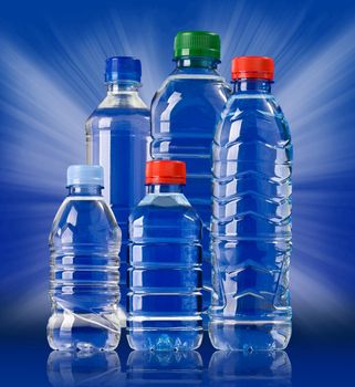 Bottles of water on blue background