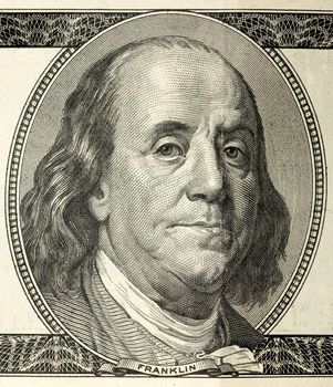 close-up portrait of Franklin with hundred dollar bills