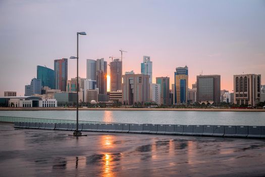 Sunrise and the skyline of Manama. Manama, Bahrain.