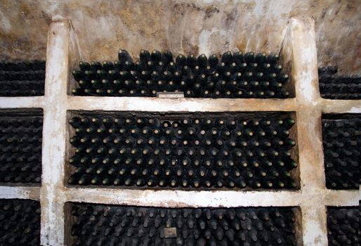 vineyard cellar with old bottles