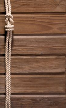 Image of old texture of wooden boards with ship rope.