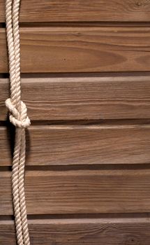 Image of old texture of wooden boards with ship rope.