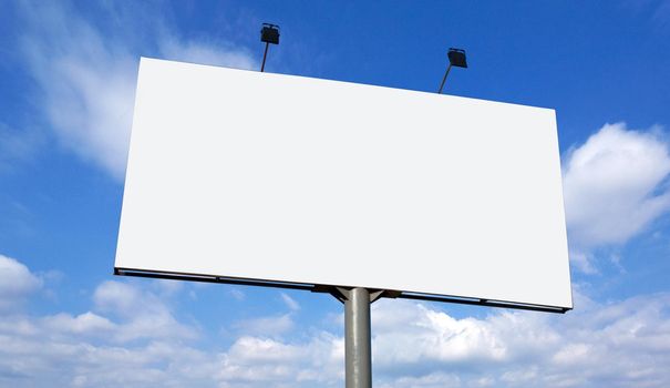 Blank billboard against blue sky, put your own text here