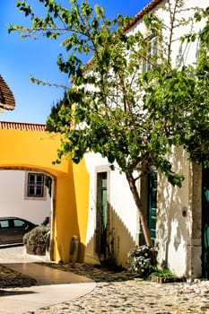 Narrow and colorful streets, majestic facades, windows and balconies of Lisbon, Portugal