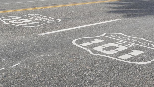 Pacific ocean Coast Highway road marking on asphalt, historic route 101, California State Route 1 roadtrip. Iconic emblem sign on freeway with dividing line in Oceanside, USA. Scenic road trip signage