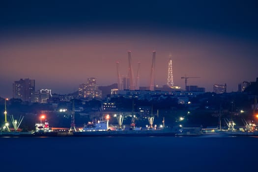 Urban landscape with a view of the night city. Vladivostok, Russia