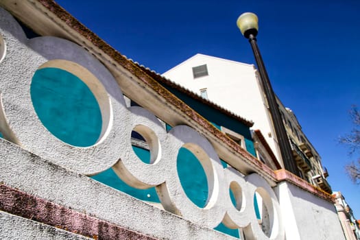 Narrow and colorful streets, majestic facades, windows and balconies of Lisbon, Portugal