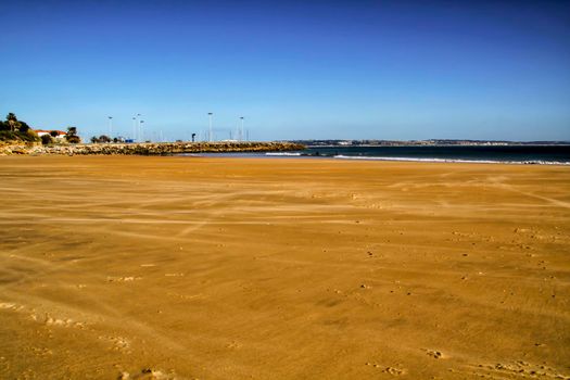 Beautiful beach called Praia da Torre in Lisbon, Portugal, in a sunny day of Spring