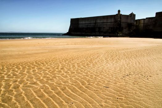 Beautiful beach called Praia da Torre in Lisbon, Portugal, in a sunny day of Spring