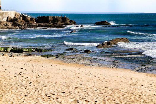 Beautiful Azarujinha beach with rock formations in Estoril, Lisbon, Portugal, in a sunny day of winter
