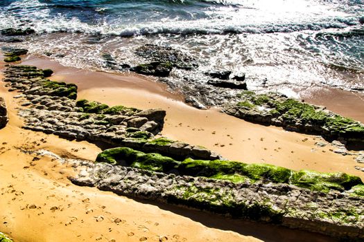 Beautiful Azarujinha beach with rock formations in Estoril, Lisbon, Portugal, in a sunny day of winter